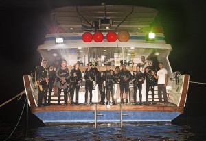 The night diving group ready to plunge into the black, wet world. 